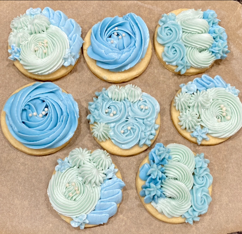 Custom decorated cookies with blue and white icing from Cottage Sweets Baking Co.