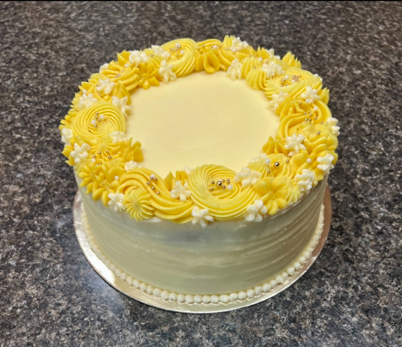 Custom yellow flower cake from Cottage Sweets Baking Co.