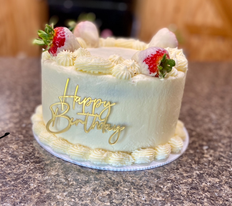 White 'Happy Birthday' custom cake from Cottage Sweets Baking Co.